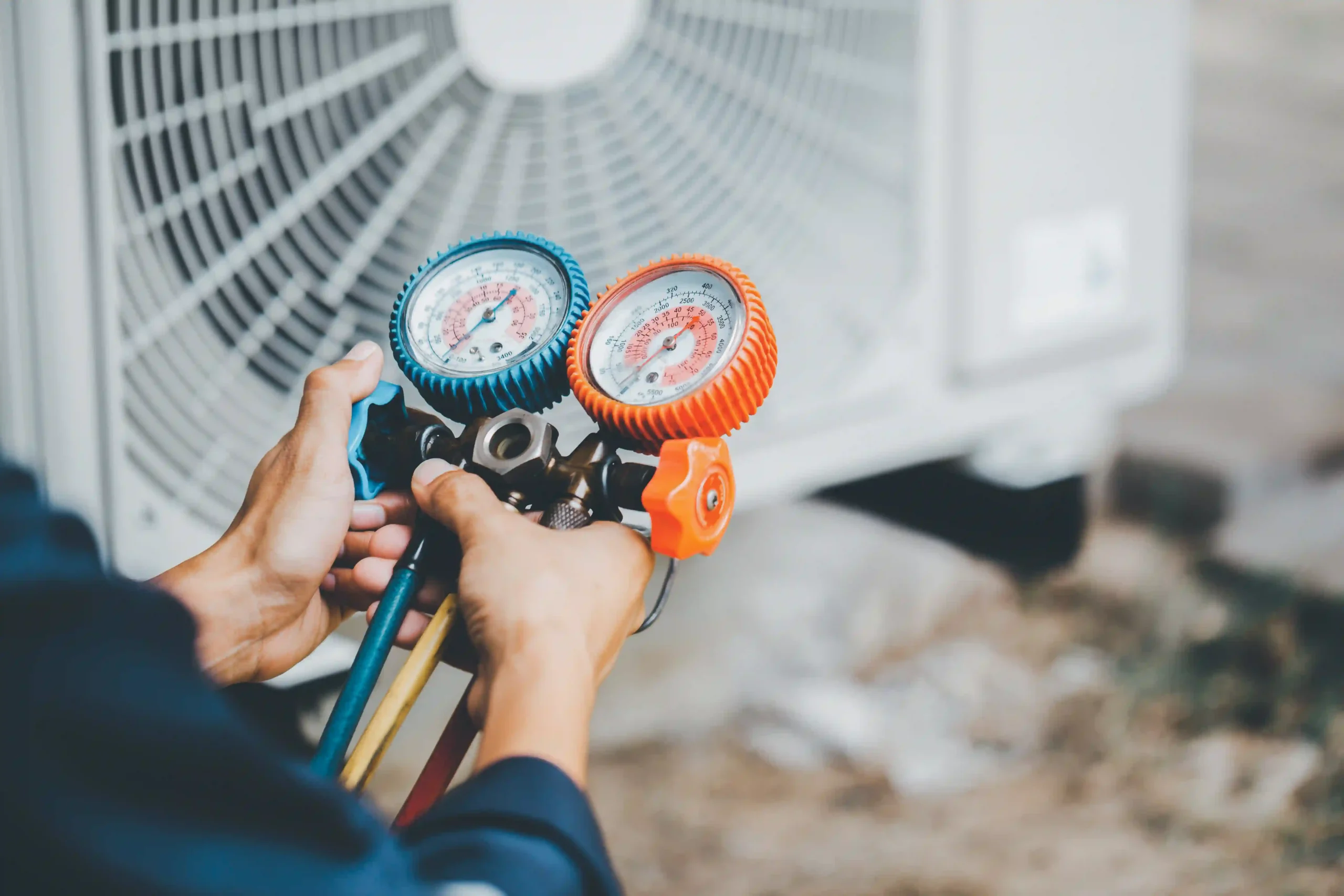 HVAC technician performing an inspection of an AC system.