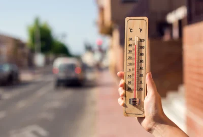 Thermostat showing extremely hot summer weather.