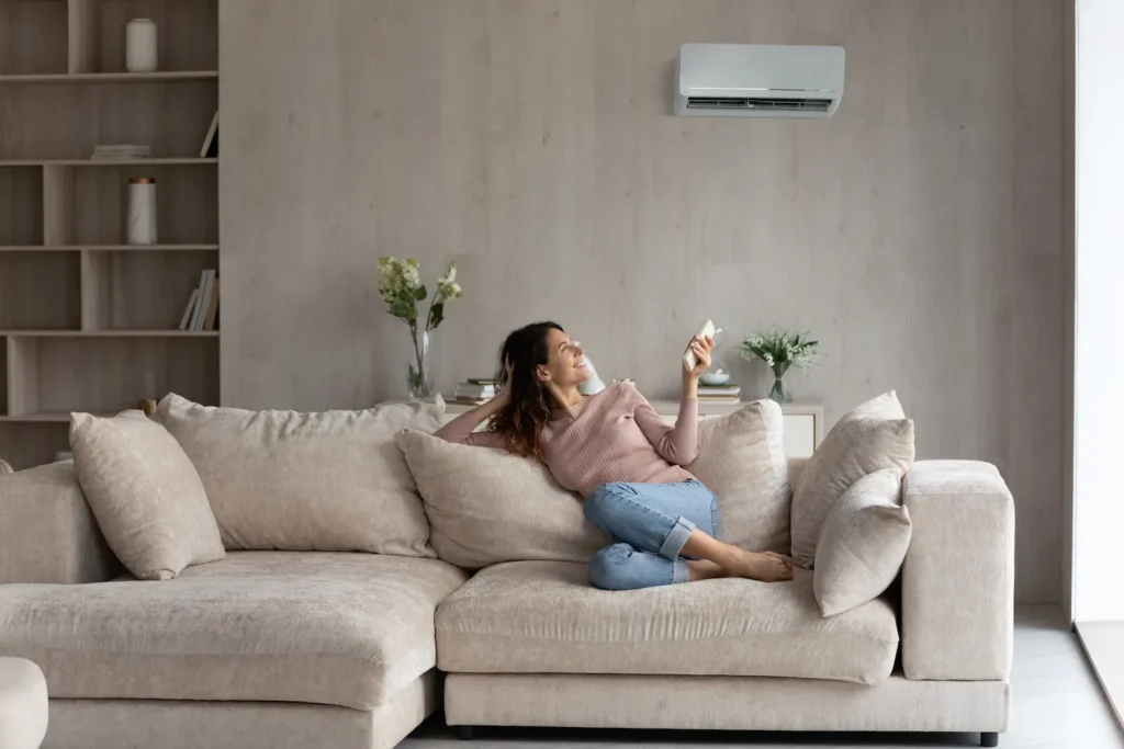 Woman relaxing on a couch enjoying her indoor air quality